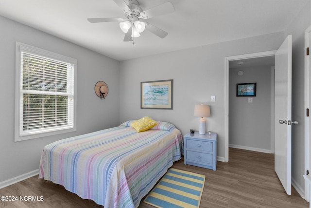 bedroom featuring ceiling fan and wood-type flooring