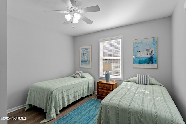 bedroom featuring dark wood-type flooring and ceiling fan