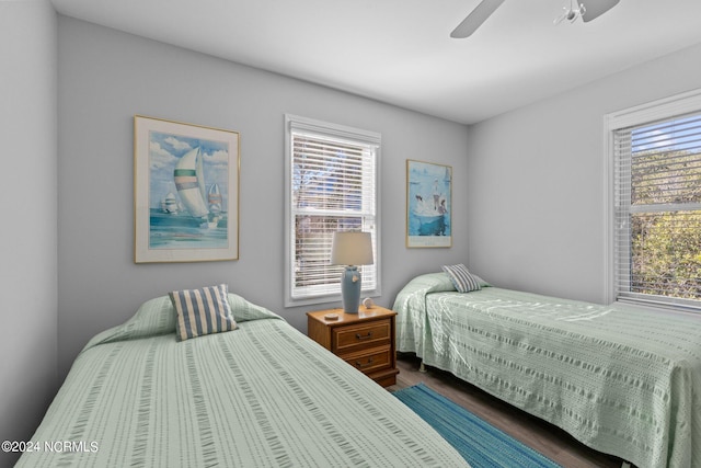 bedroom featuring dark wood-type flooring and ceiling fan