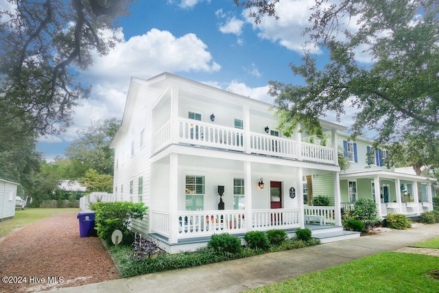 view of front of house featuring a balcony and a porch