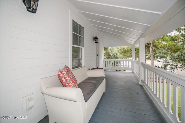 wooden deck featuring covered porch