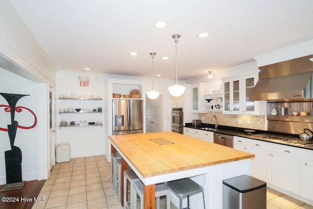 kitchen featuring a sink, appliances with stainless steel finishes, open shelves, butcher block countertops, and white cabinets