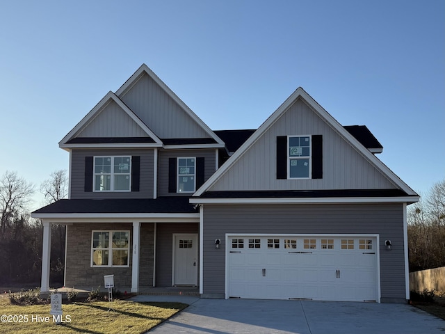 view of front facade with covered porch and a garage