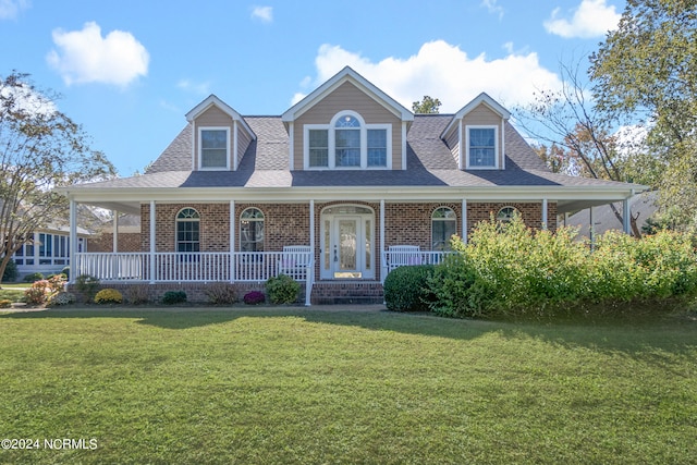 view of front of property featuring a porch and a front yard