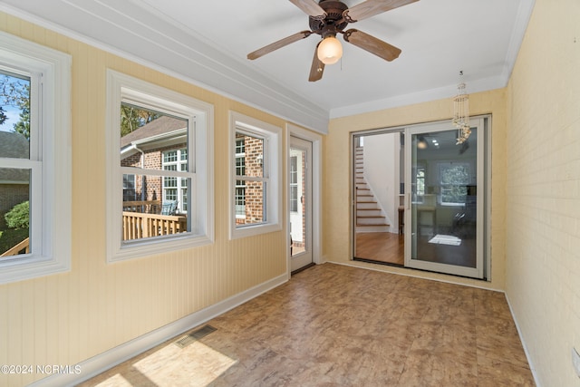 interior space with ceiling fan