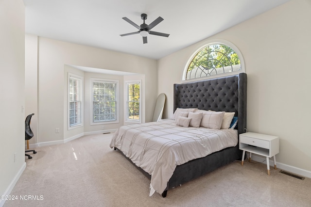 bedroom with light colored carpet and ceiling fan