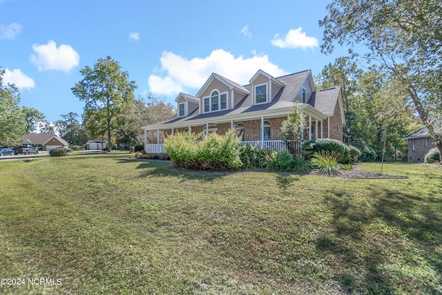 view of front facade featuring a front lawn and covered porch