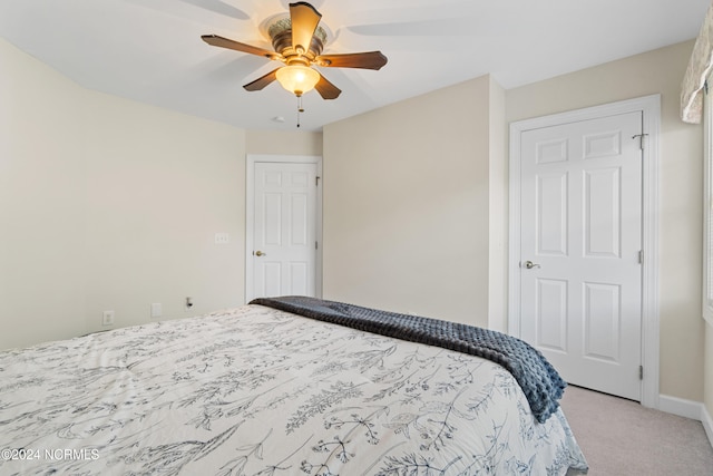 carpeted bedroom with ceiling fan