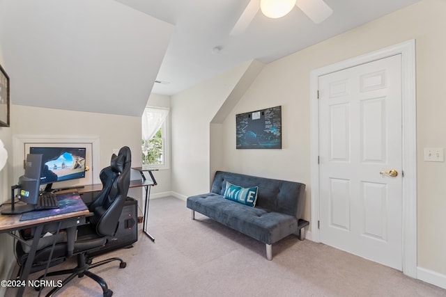 office space with ceiling fan, lofted ceiling, and light colored carpet