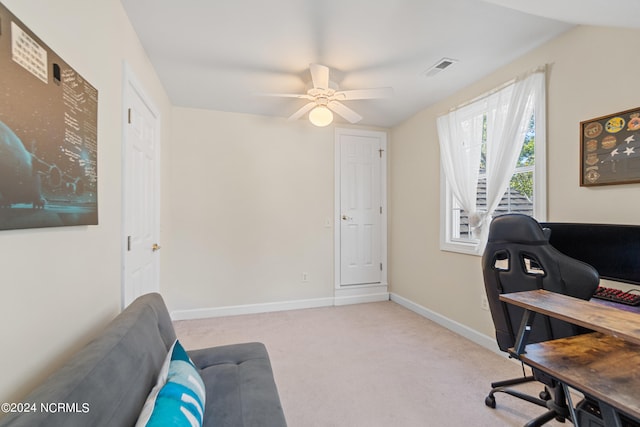 carpeted office with ceiling fan