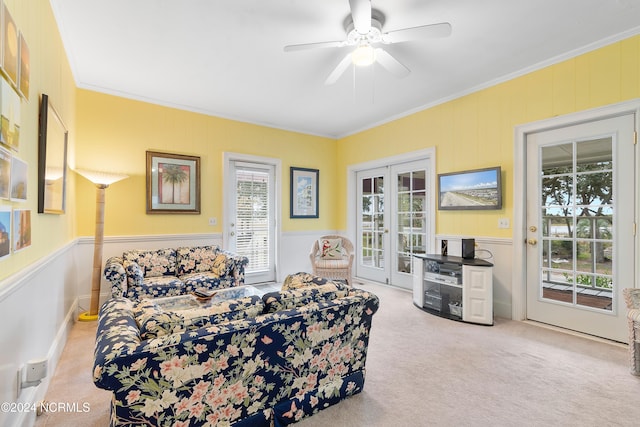 bedroom with crown molding, light colored carpet, access to outside, and ceiling fan