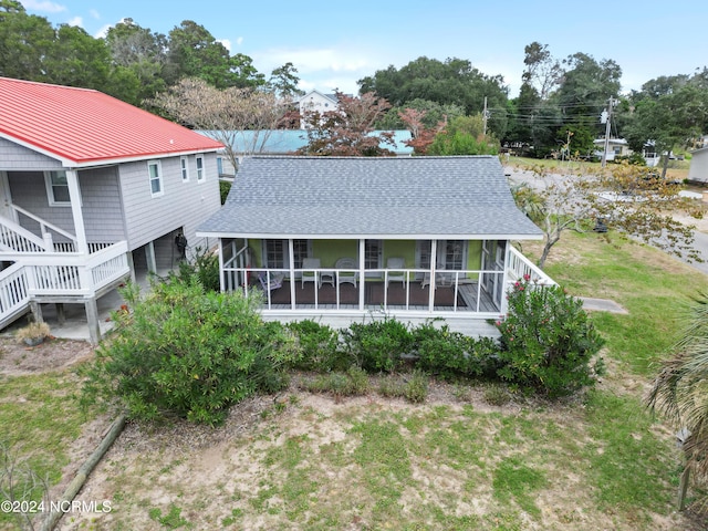 back of house with a sunroom