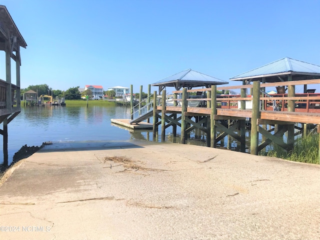 dock area with a gazebo and a water view