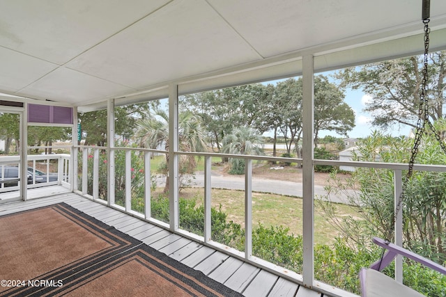 unfurnished sunroom featuring plenty of natural light