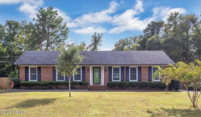 ranch-style house featuring a front lawn