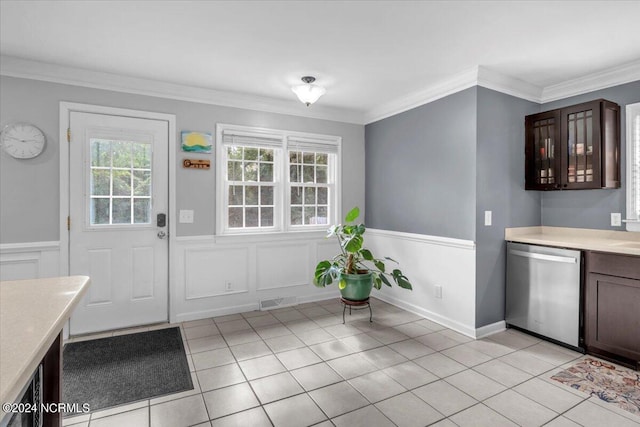 doorway with light tile patterned flooring and crown molding