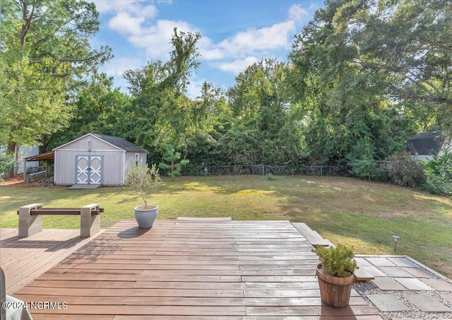 deck featuring a lawn and a shed