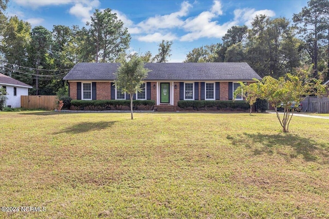 single story home featuring a front yard