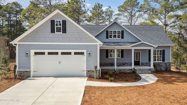 craftsman-style house with covered porch and a garage