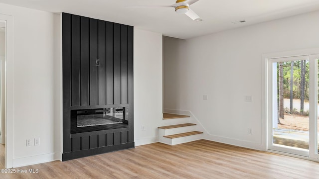 spare room featuring ceiling fan and light wood-type flooring