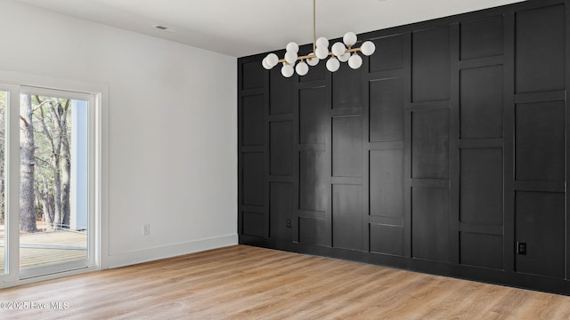 unfurnished room with light wood-type flooring