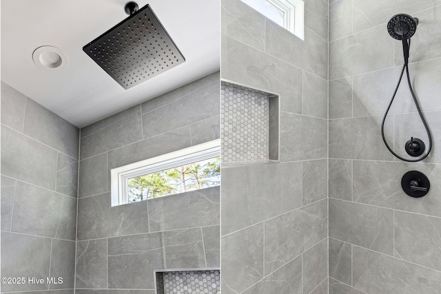 bathroom with tiled shower