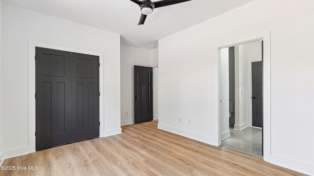 unfurnished bedroom with light hardwood / wood-style floors, a closet, and ceiling fan