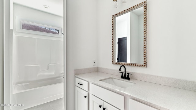 bathroom with shower / bathing tub combination and vanity