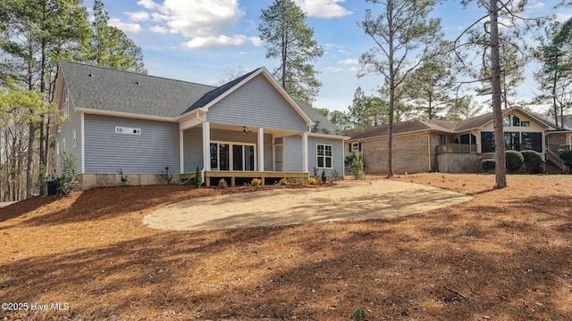 rear view of property with ceiling fan