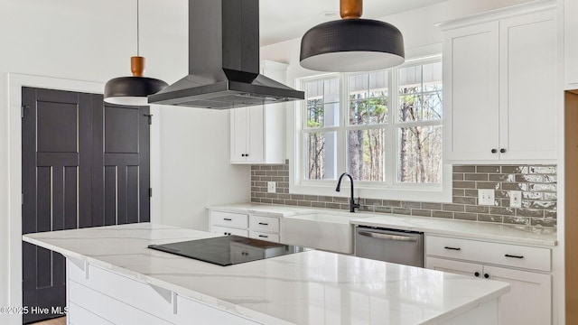 kitchen featuring white cabinetry, stainless steel dishwasher, island range hood, and pendant lighting