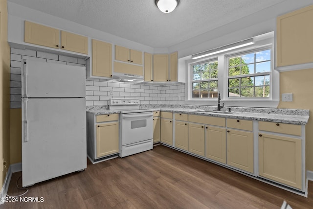 kitchen featuring sink, white appliances, backsplash, extractor fan, and dark hardwood / wood-style floors