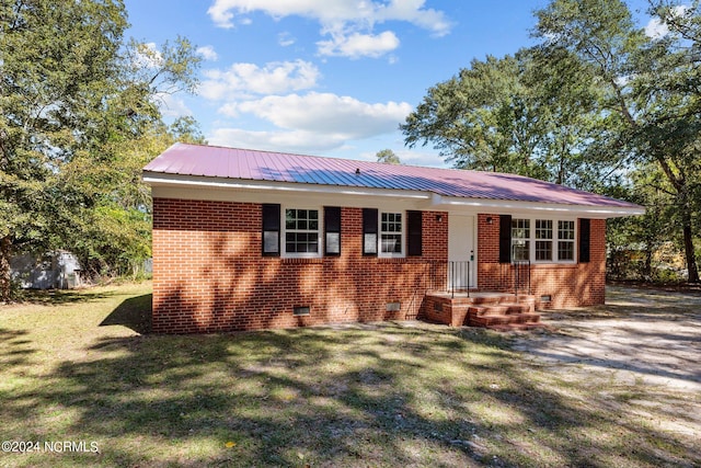 view of front of home with a front yard