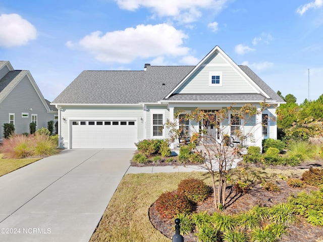 view of front of property featuring a garage and covered porch