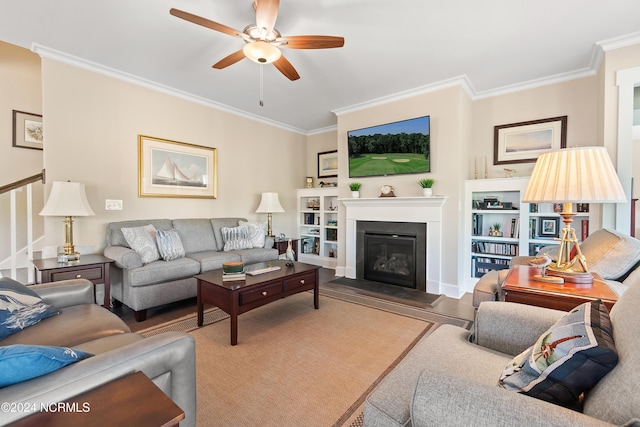 living room with ceiling fan and crown molding