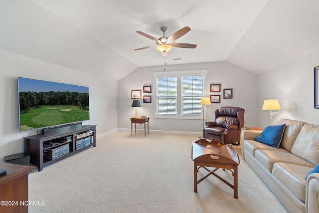 living room featuring ceiling fan, light carpet, and vaulted ceiling