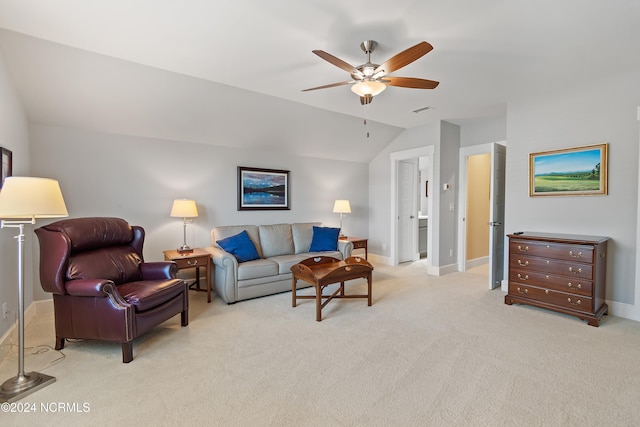 carpeted living room featuring vaulted ceiling and ceiling fan