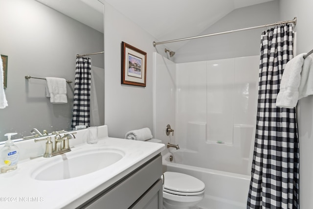 full bathroom with lofted ceiling, shower / bath combo with shower curtain, toilet, and vanity