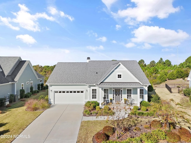 view of front of property with a garage and a porch