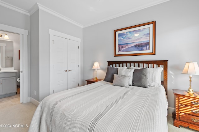 bedroom featuring connected bathroom, a closet, light colored carpet, and crown molding