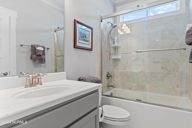 full bathroom with shower / bath combination with glass door, vanity, toilet, and ornamental molding