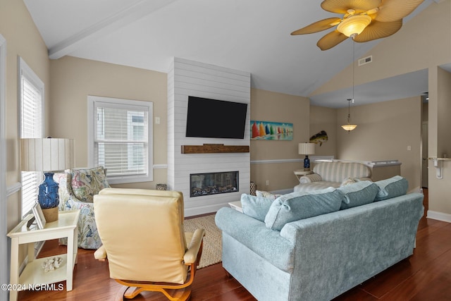 living room featuring vaulted ceiling with beams, ceiling fan, a fireplace, and dark hardwood / wood-style flooring