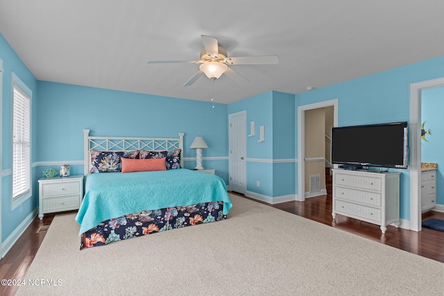 bedroom with dark wood-type flooring and ceiling fan