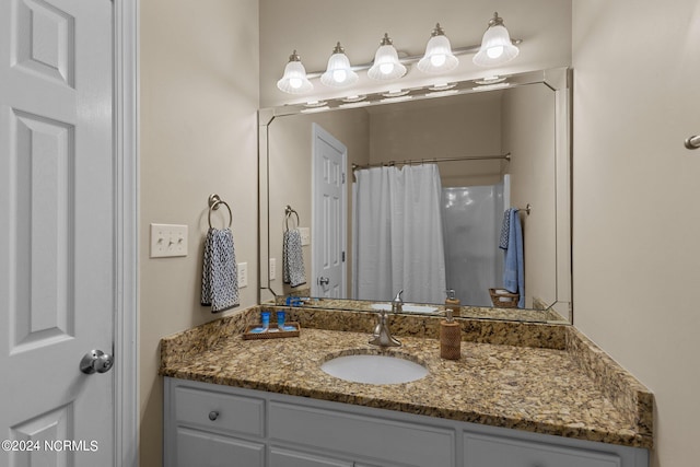 bathroom featuring vanity and walk in shower