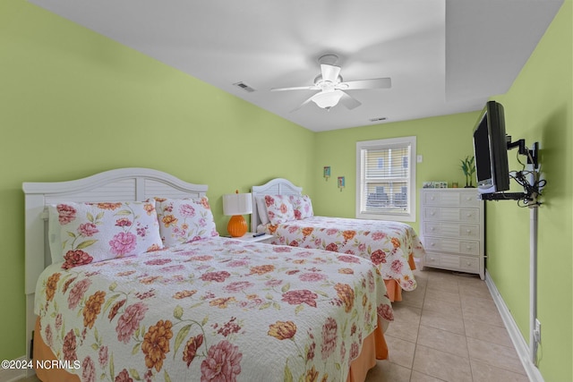 tiled bedroom with ceiling fan