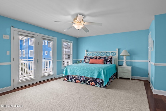 bedroom with hardwood / wood-style floors, access to exterior, and ceiling fan