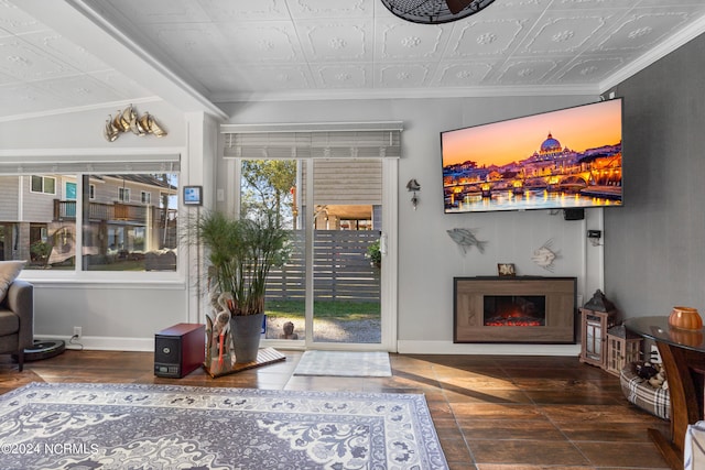 living room featuring lofted ceiling, hardwood / wood-style floors, and ornamental molding