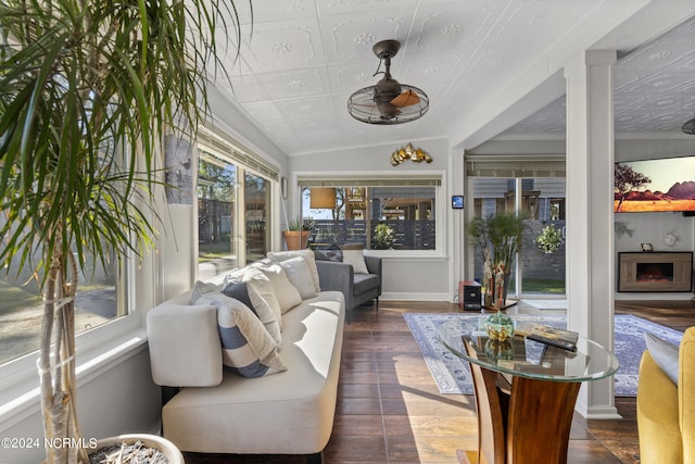 sunroom / solarium featuring vaulted ceiling