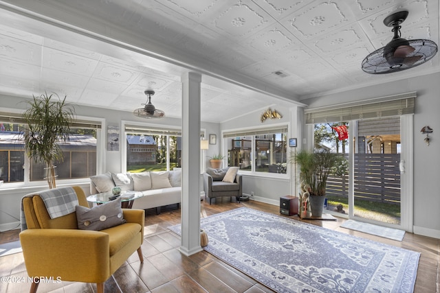 sunroom / solarium featuring lofted ceiling