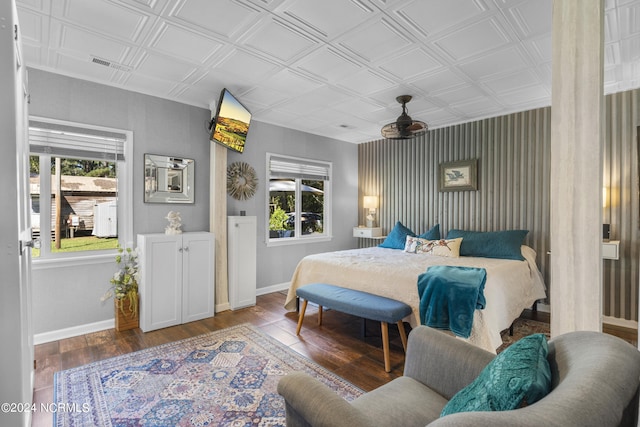 bedroom featuring multiple windows and hardwood / wood-style floors