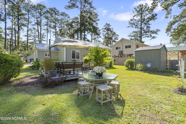 view of yard featuring a patio and a storage shed